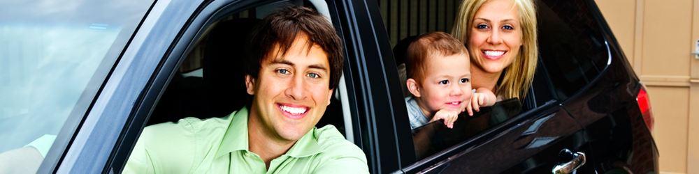 a family in a black car